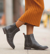 A woman wearing black Nandi Chelsea boots by Bed Stu.