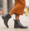 A woman wearing black Nandi Chelsea boots by Bed Stu.