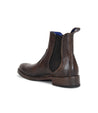 A brown leather Bed Stu Chelsea boot with a blue sole.