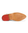 A Neftis shoe with a red sole on a white background by Bed Stu.