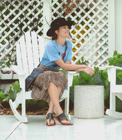 A woman wearing a Nemesis Bed Stu's leather sandals.