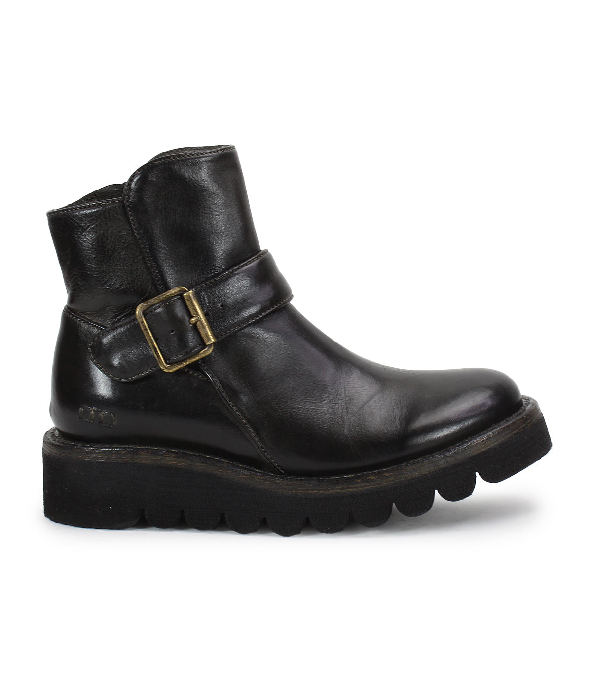 The Bed Stu Nudge II is a black leather ankle boot with a thick ridged sole, adjustable side buckle strap, and slight heel, displayed in left profile against a white background.