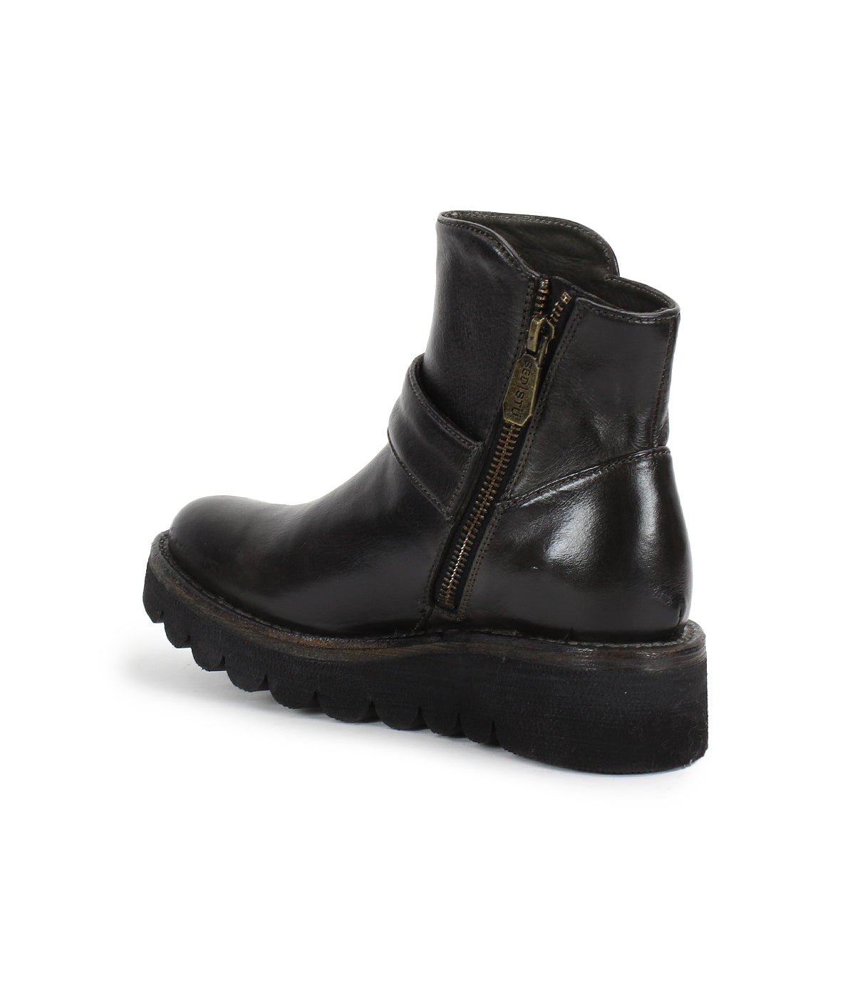 The Bed Stu Nudge II is a black leather ankle boot with a thick treaded sole, adjustable strap, and visible side zipper, displayed at an angle on a white background.