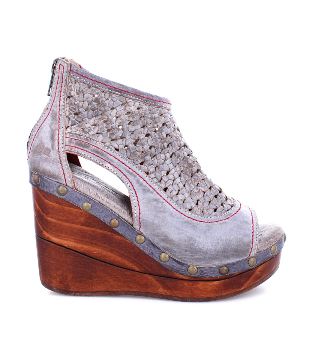An Odette by Bed Stu women's grey wedge sandal with a wooden platform.