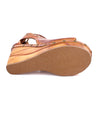 A pair of Odette women's sandals with a wooden sole by Bed Stu.