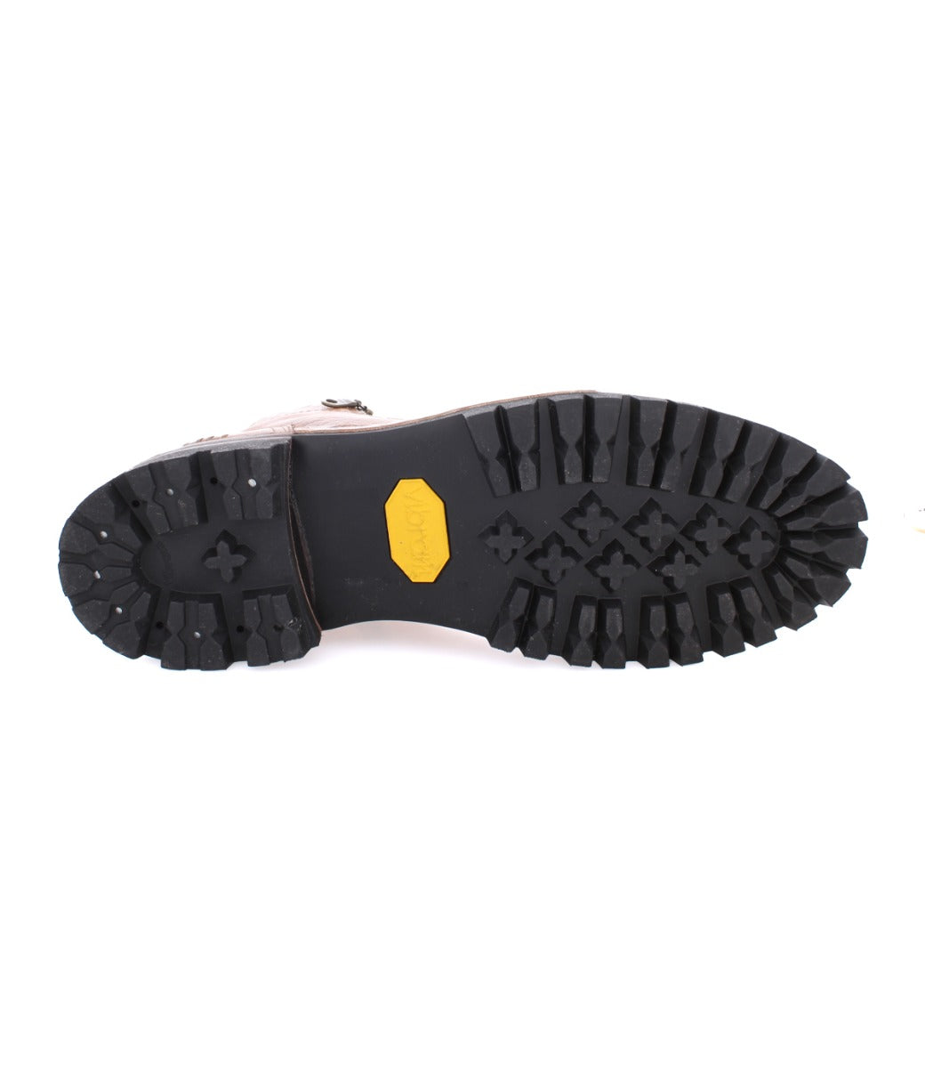 A pair of Old Bowen Trek shoes with yellow soles on a white background, by Bed Stu.