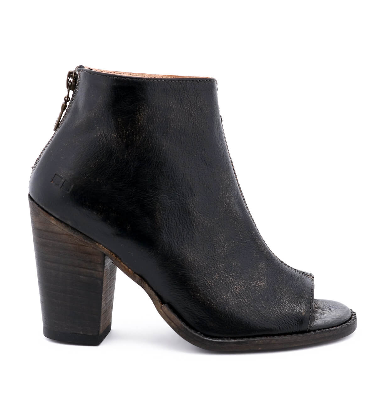 A black leather Onset ankle boot with a wooden heel by Bed Stu.