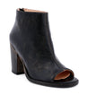 A black peep toe bootie with a wooden heel, the Onset by Bed Stu.