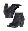 A pair of Onset black leather ankle boots with a wooden heel by Bed Stu.