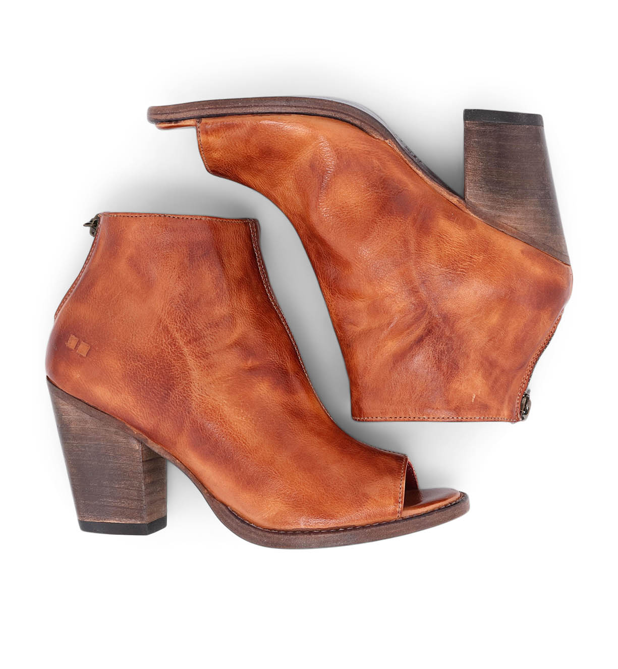 A pair of Bed Stu Onset tan leather ankle boots with a wooden heel.