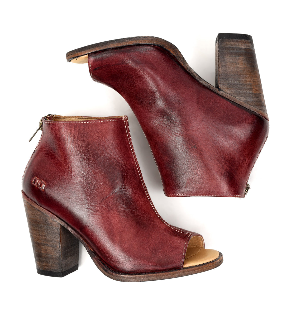 A pair of Bed Stu Onset burgundy leather ankle boots with wooden heel.