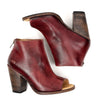 A pair of Bed Stu Onset burgundy leather ankle boots with wooden heel.