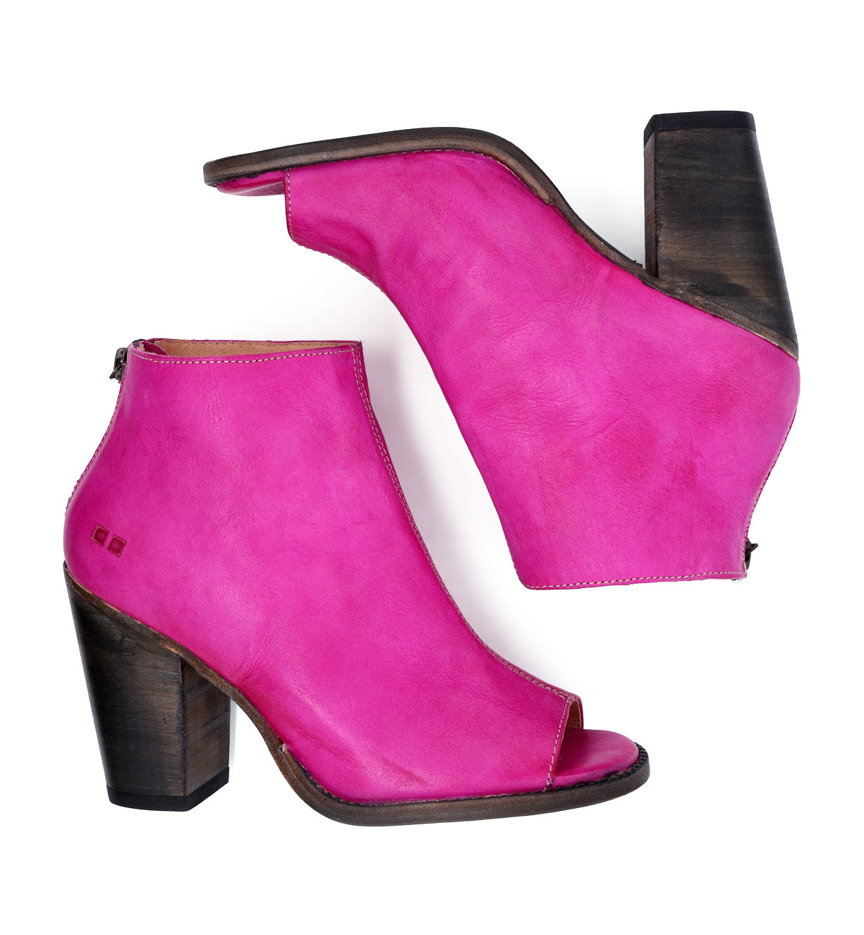 A pair of pink peep toe ankle boots with a wooden heel, the Onset by Bed Stu.