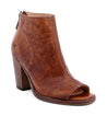 A women's brown peep toe bootie with a wooden heel called "Onset" by the brand "Bed Stu".
