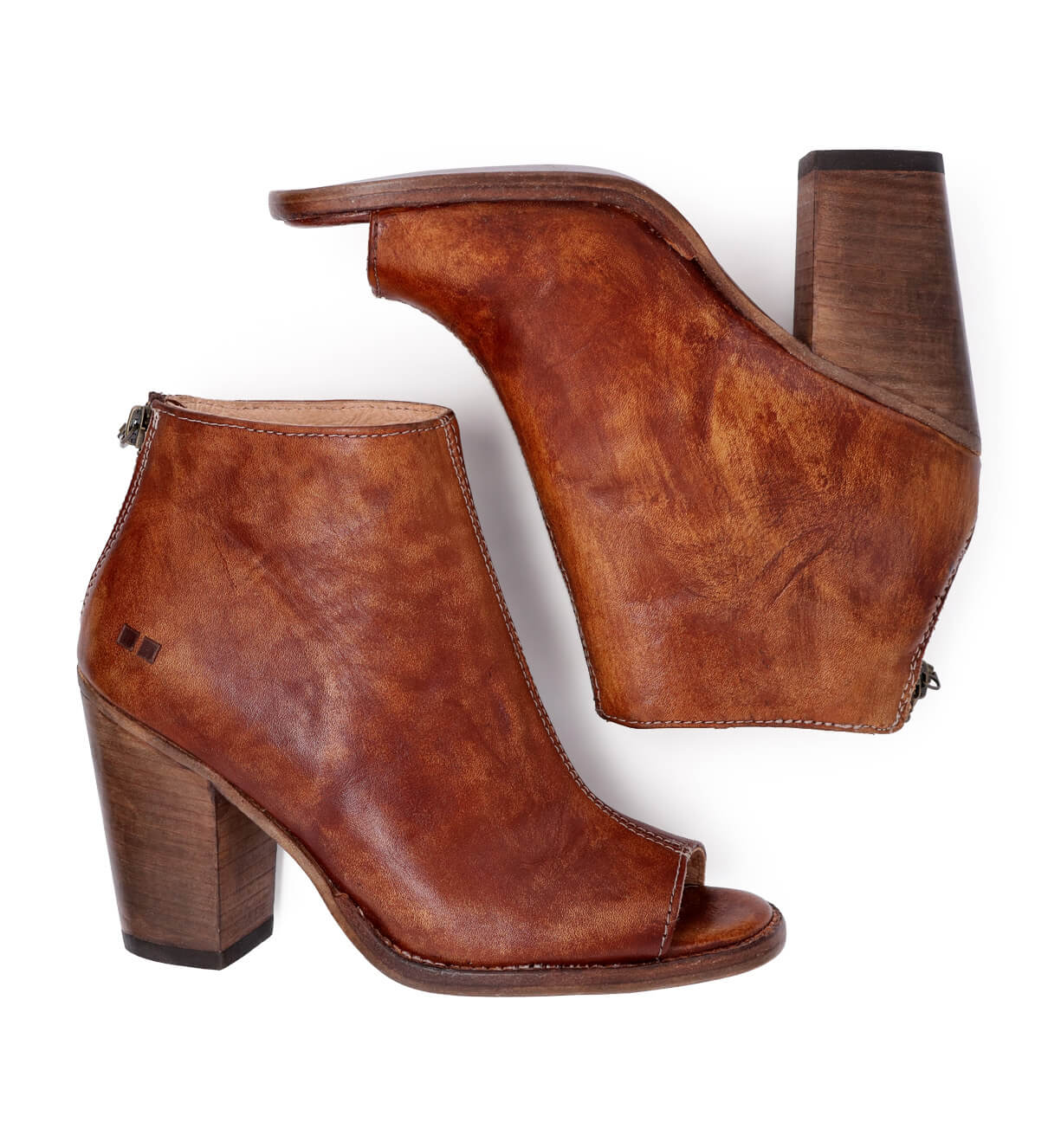 A pair of Onset brown leather ankle boots with a wooden heel by Bed Stu.
