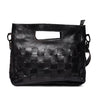 A black woven Orchid handbag by Bed Stu.