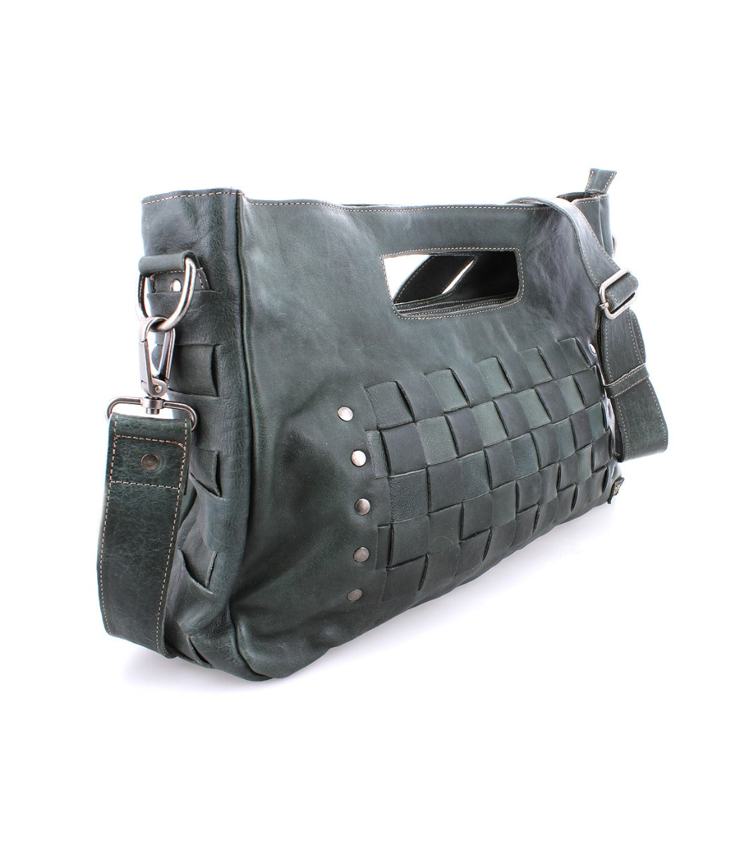 A Bed Stu Orchid L green leather handbag with straps and buckles.