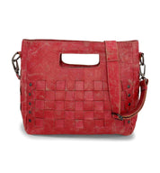 A distressed red Orchid handbag by Bed Stu with a strap.