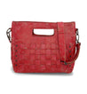 A distressed red Orchid handbag by Bed Stu with a strap.
