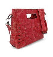 A distressed red Orchid handbag by Bed Stu with a strap.