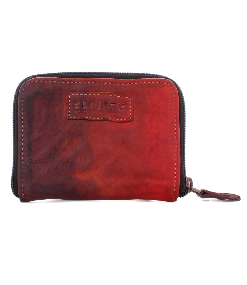 An Ozzie by Bed Stu red leather wallet on a white background.