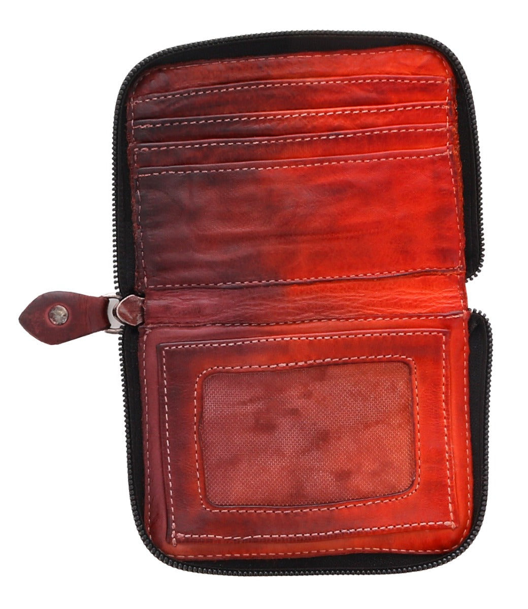 An Ozzie by Bed Stu red leather wallet with a zipper.