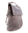 A grey Patsy backpack with perforations on it. Brand: Bed Stu.