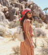 A woman wearing a Bed Stu Patsy dress and sunglasses in the desert.