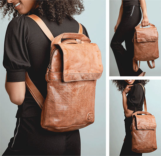 A woman wearing a tan leather Bed Stu Patsy backpack.