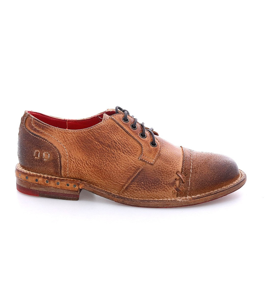 A men's brown Bed Stu Plio derby shoe with a red sole.