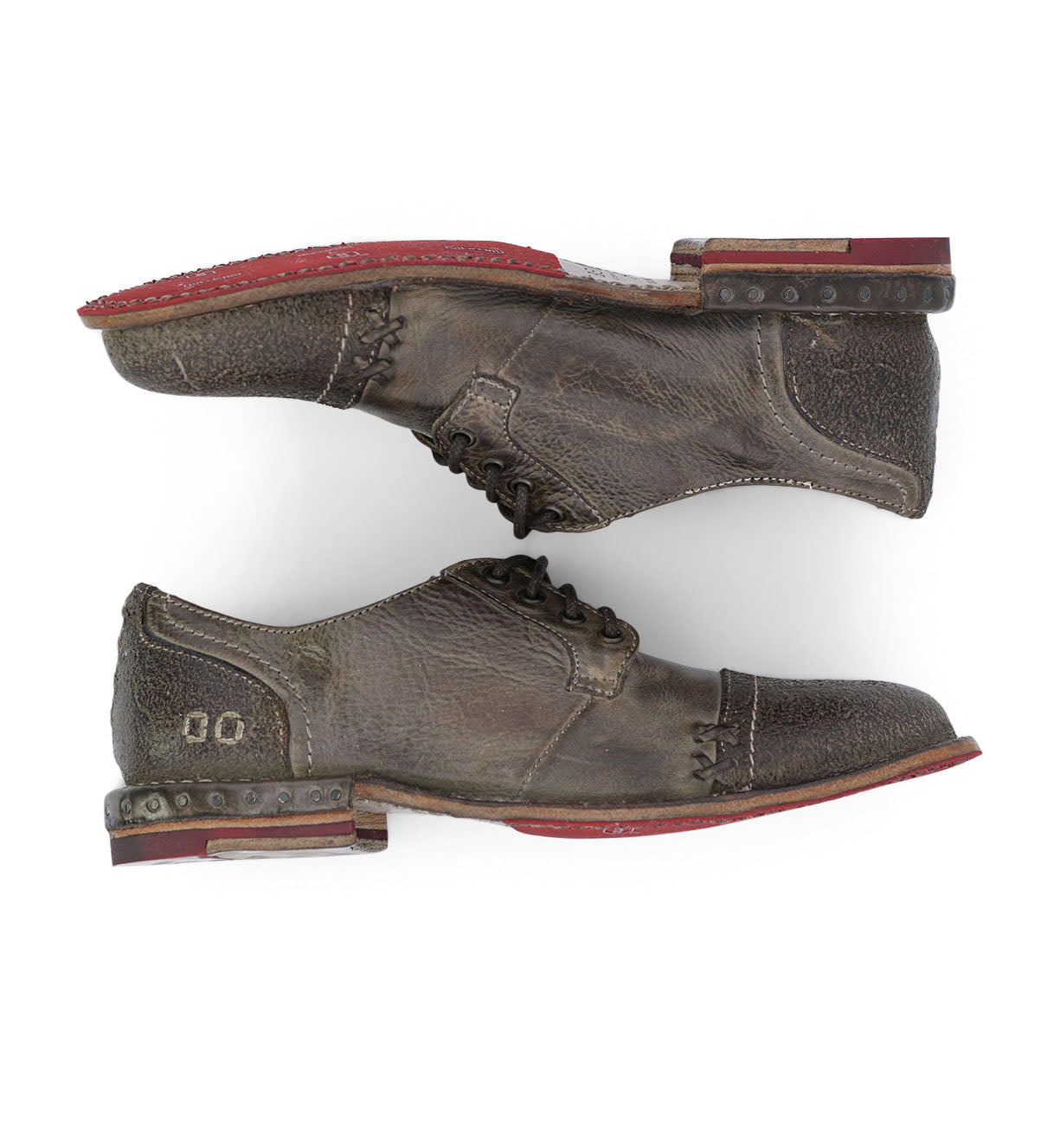 A pair of Plio brown oxford shoes with red soles by Bed Stu.