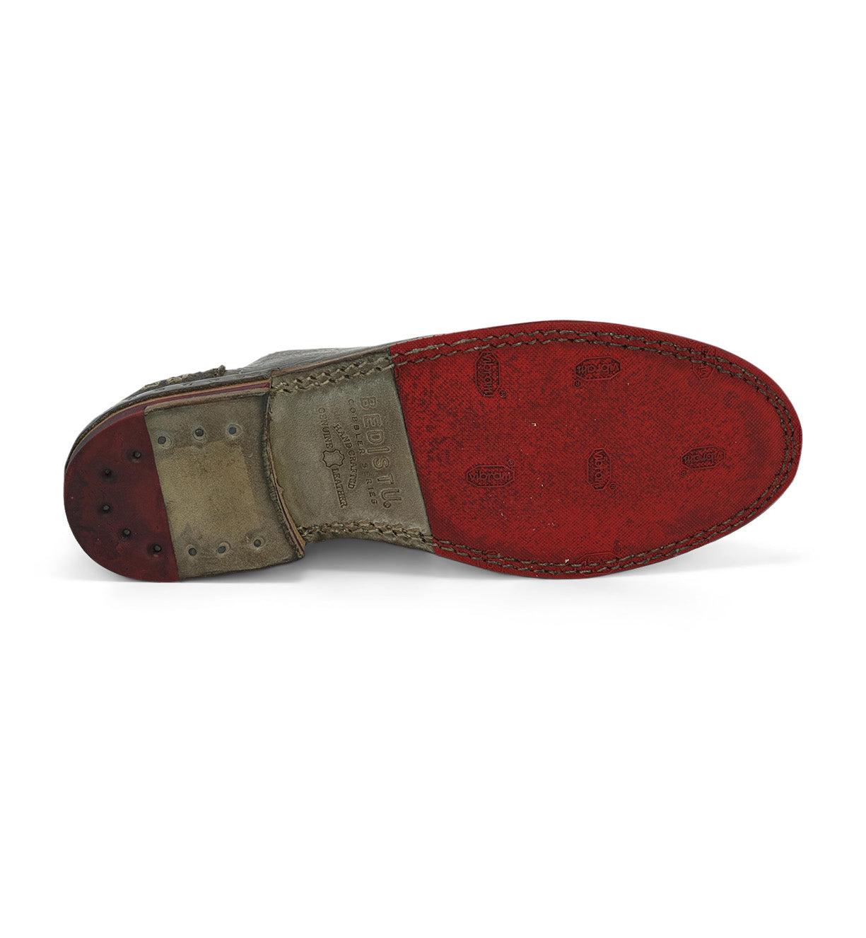 A pair of Bed Stu Plio shoes with red soles on a white background.