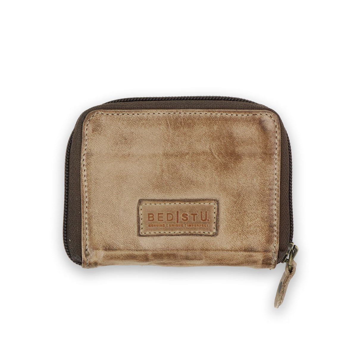 The Plus by Bed Stu is a brown leather wallet with a distressed texture and zipper closure. Featuring the BED|STÜ logo, it offers a compact design and multiple card slots, combining functionality with style.