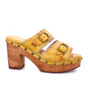 A women's yellow Poly sandal with a wooden heel by Bed Stu.