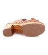 The back of a Bed Stu women's shoe with a wooden sole.