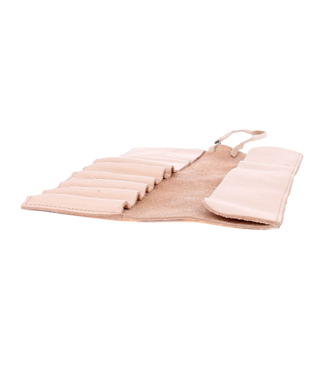 A beige Prepped Leather Wrap with multiple slots, perfect for artist tools, shown open and laid flat. Crafted by the renowned Bed Stu.