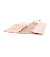 A beige leather Prepped case with a number of compartments. Brand: Bed Stu.
