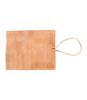 A tan leather pouch with a wrist strap and multiple parallel slits on one side, perfect for organizing artist tools. The word "Bed Stu" is embossed near the top right corner, showcasing its craftsmanship from a renowned Prepped Leather Wrap.