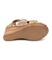 Side view of Bed Stu's Princess wedge sandal, showcasing its woven strappy uppers with a leather finish, rivet accents, and a textured sole for extra grip.