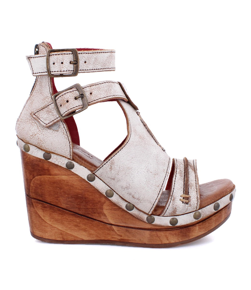 A women's white wedge sandal with straps and wooden platform called the Princess by Bed Stu.
