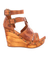 A women's Princess wooden wedge sandal from Bed Stu with straps and buckles.