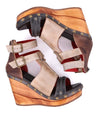 A pair of Bed Stu Princess women's wedge sandals with straps and buckles.