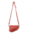 A Priscilla crossbody bag by Bed Stu hanging on a white background.