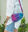 A woman wearing shorts and a Priscilla tie dye bag by Bed Stu.