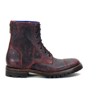 Introducing the Protege Trek combat-style boot by Bed Stu, featuring a dark red and black leather design with a rugged Vibram outsole, lace-up construction, and a convenient back zipper.