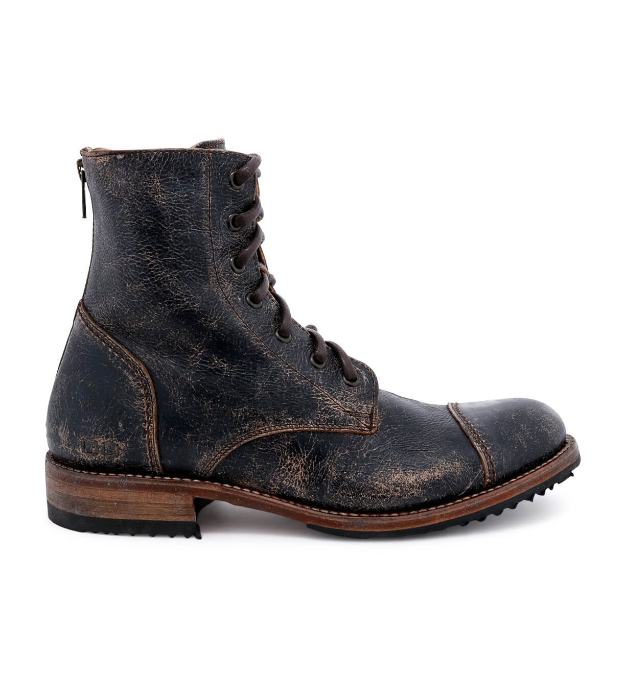 A single worn black leather Bed|Stü Protege lace-up combat boot, featuring a wooden sole, Goodyear welt construction, and a back zipper, shown from the side against a white background.