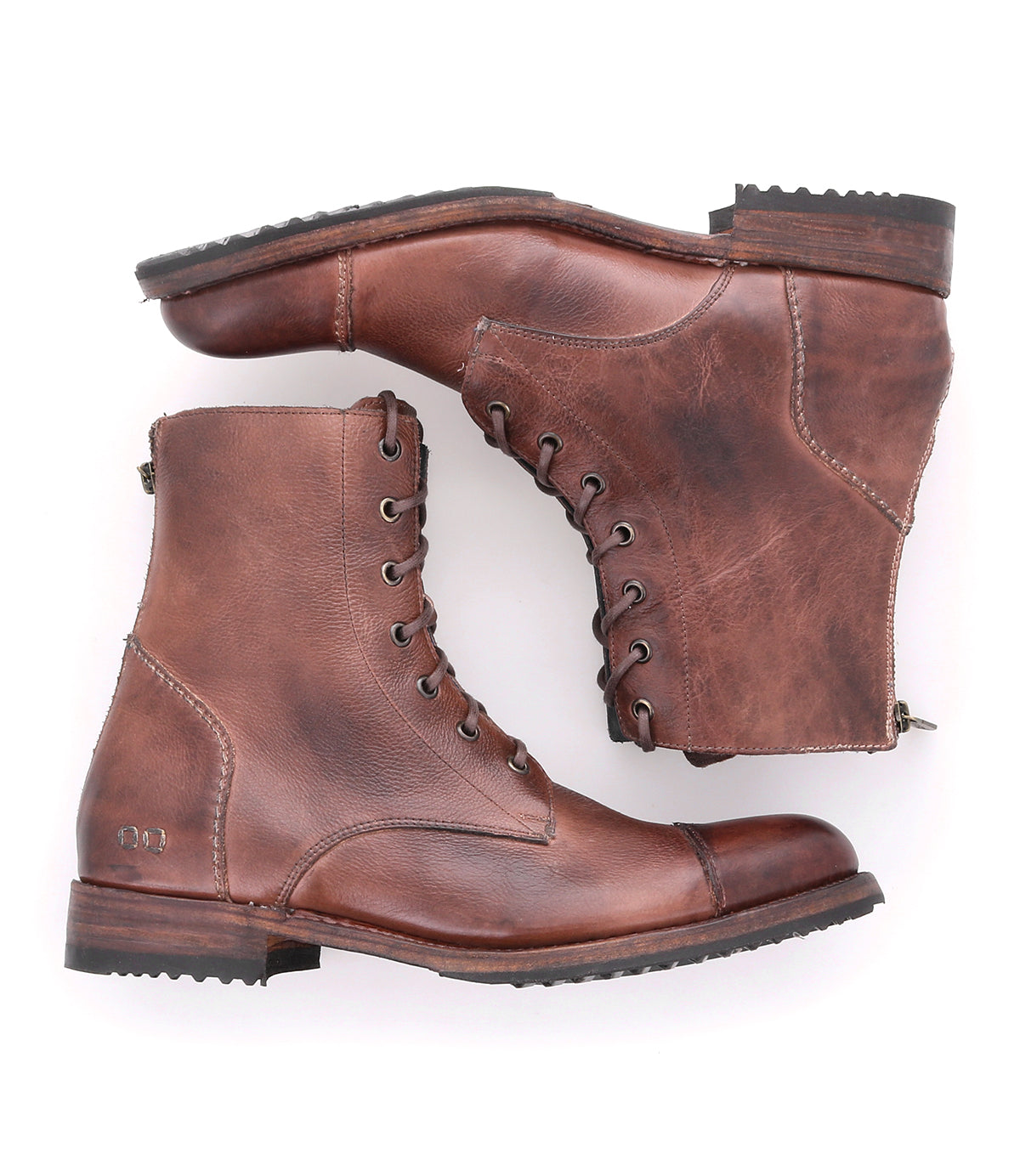 A pair of Protege brown leather boots on a white background. (Brand: Bed Stu)