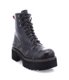 A Prudence Hi by Bed Stu leather combat boot with lace ups and a rubber sole.