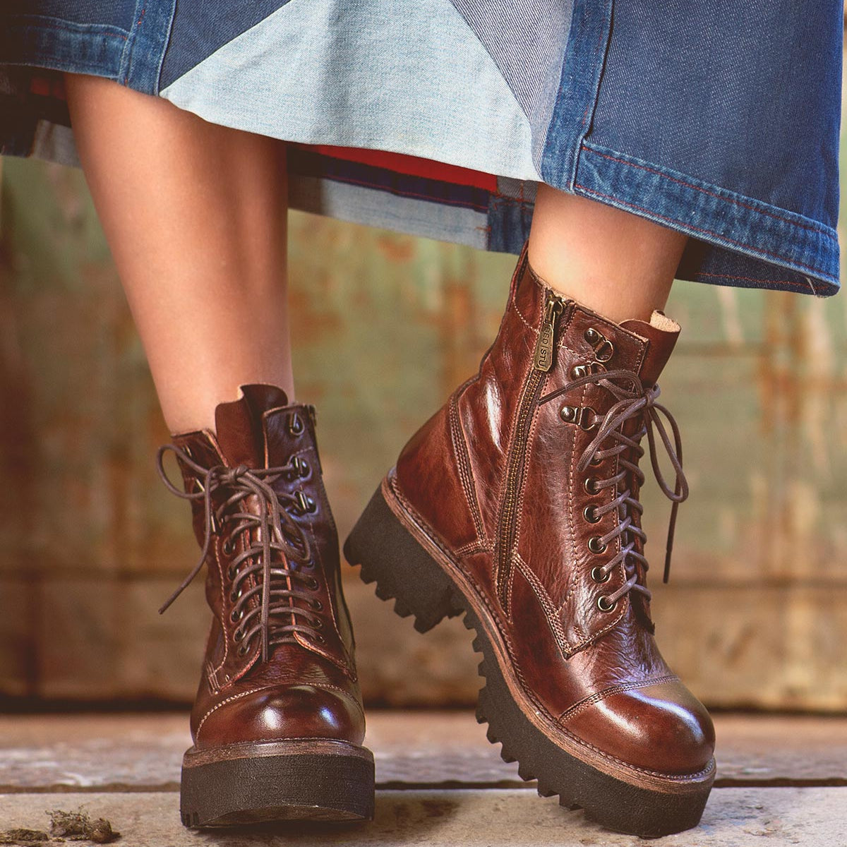 An edgy woman wearing Bed Stu's Prudence Hi with a denim skirt.