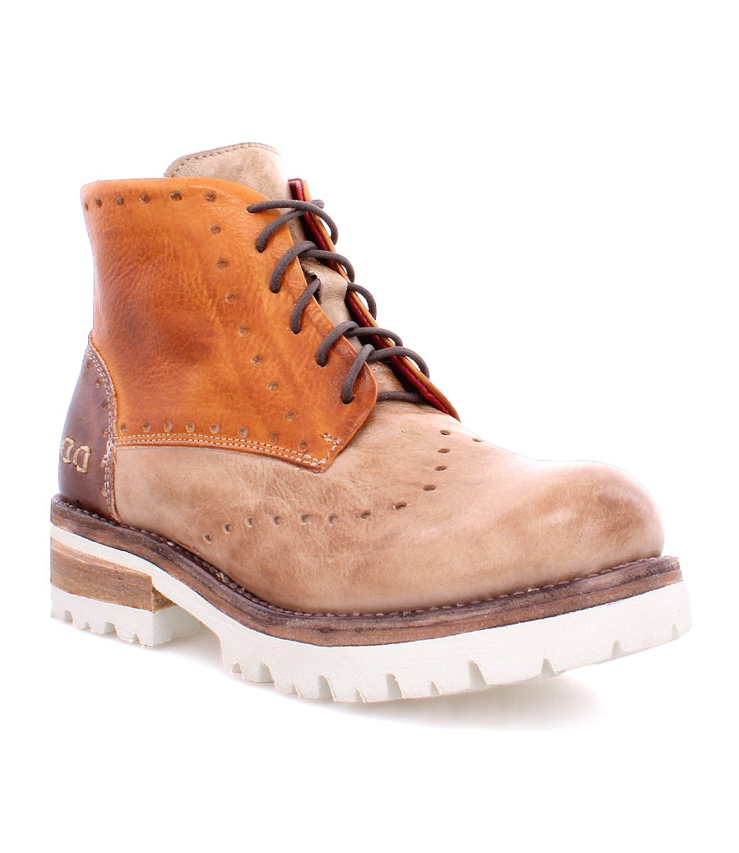 A pair of Bed Stu Quatro III brown and tan boots with a white sole.